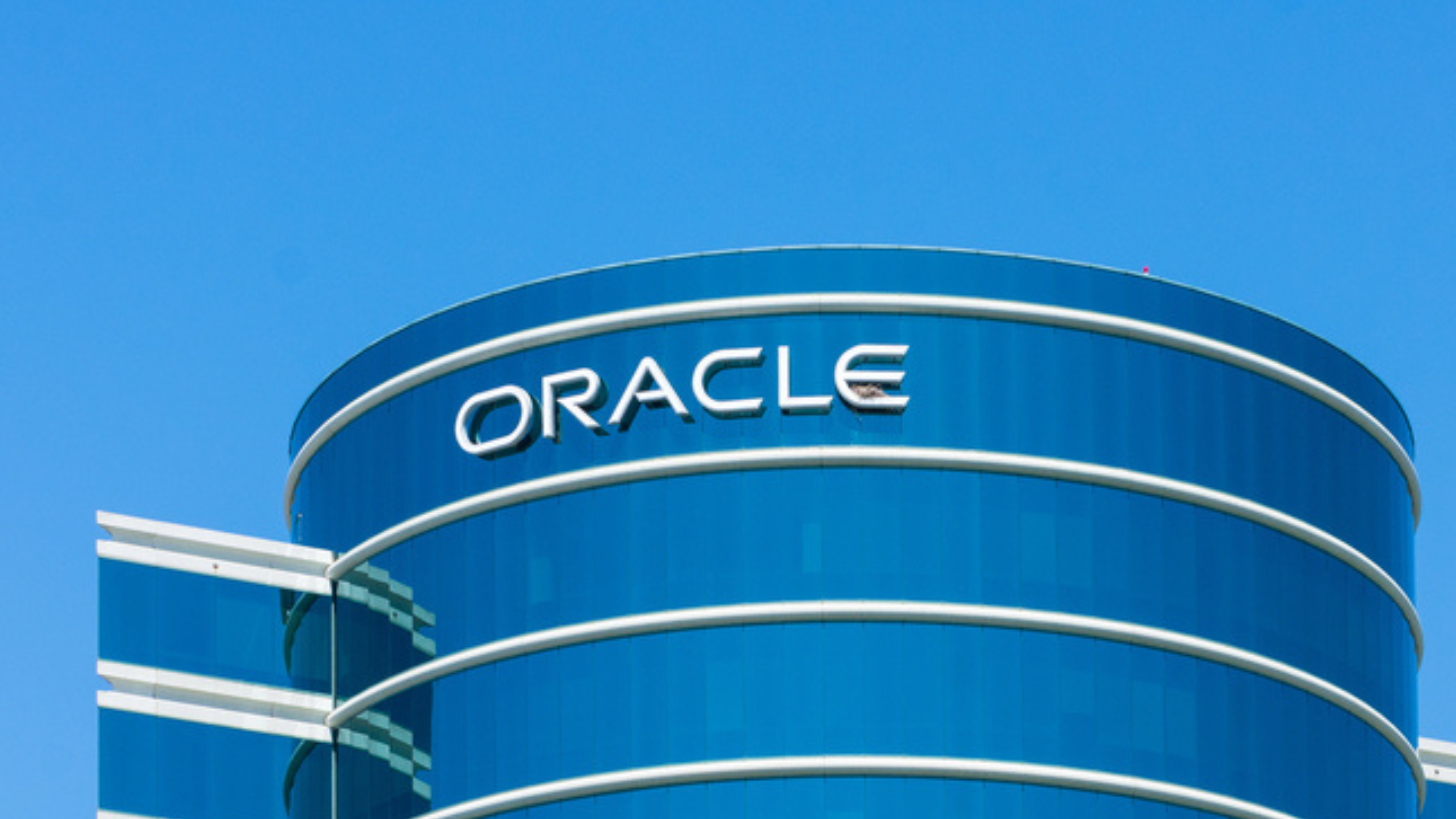 Oracle sign atop company headquarters in Silicon Valley, high-tech hub of San Francisco Bay Area - Redwood City, CA, USA - 2019