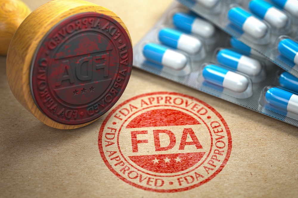 FDA approved concept. Rubber stamp with FDA and pills on craft