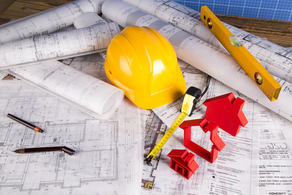 Buildings under construction and cranes. Building projects