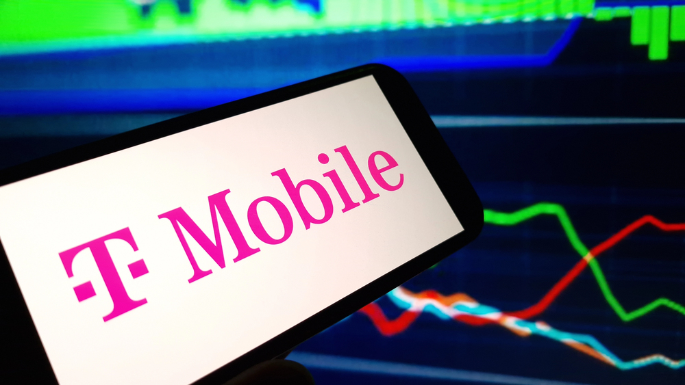 T Mobile Logo on Cellphone, stock chart 