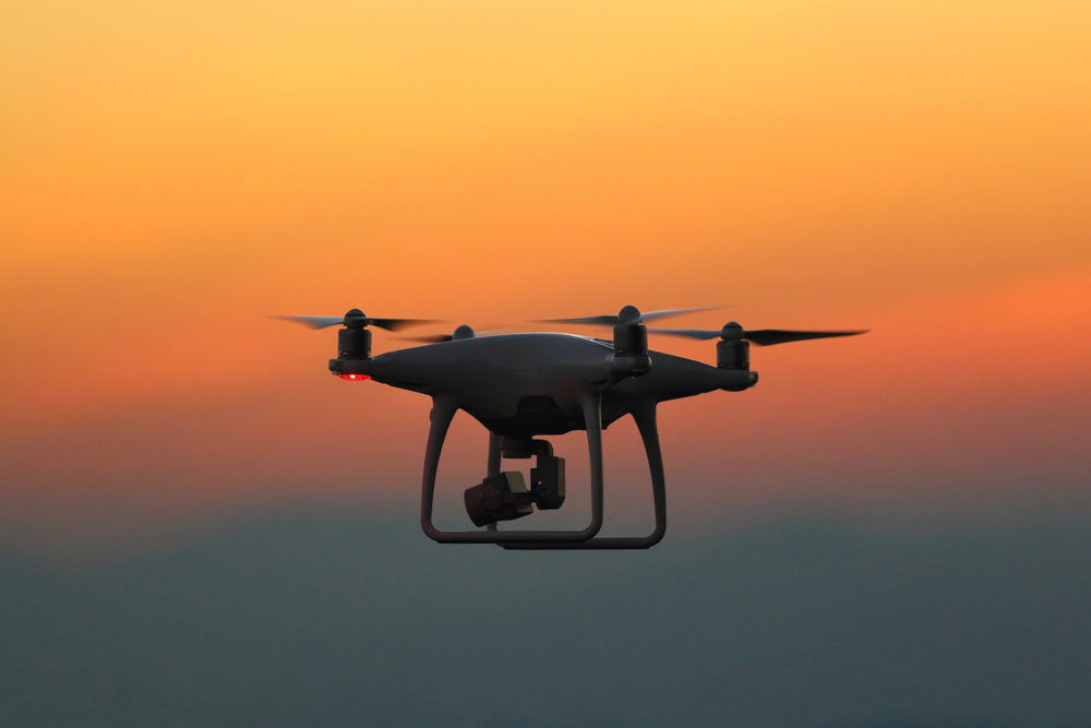 Silhouette drones.Drone flying in the sunset — Photo