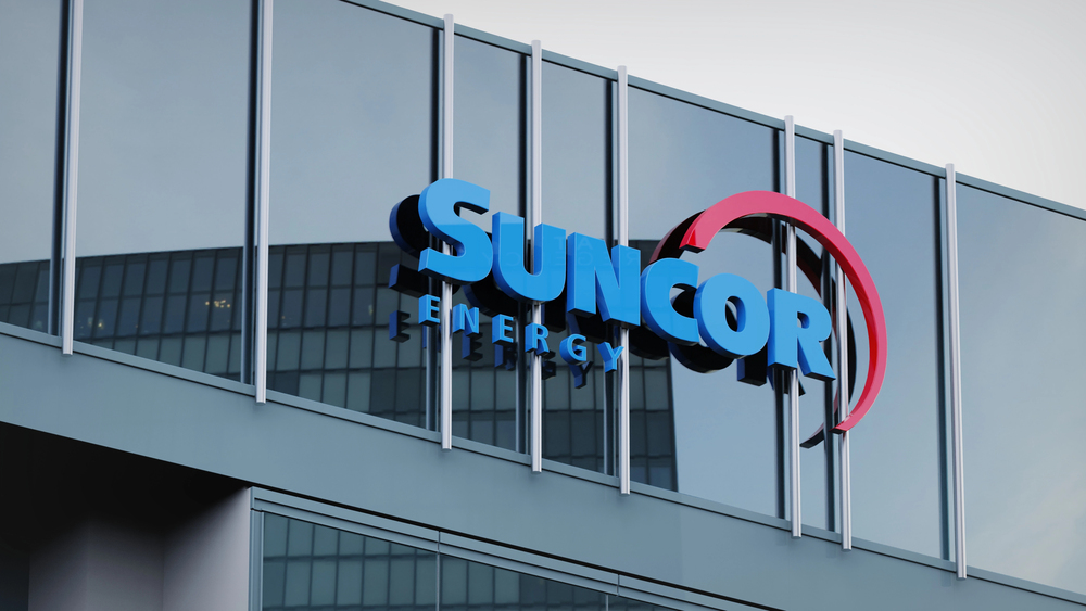 Suncor energy stock data presented on the logo of the office facade editorial