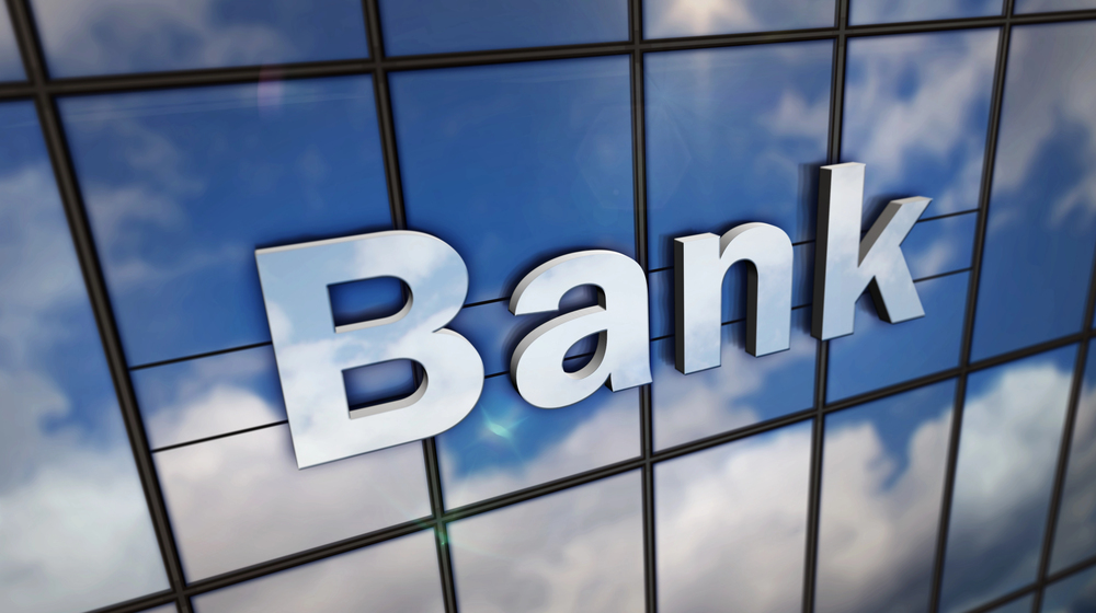 Bank sign on a glass building exterior