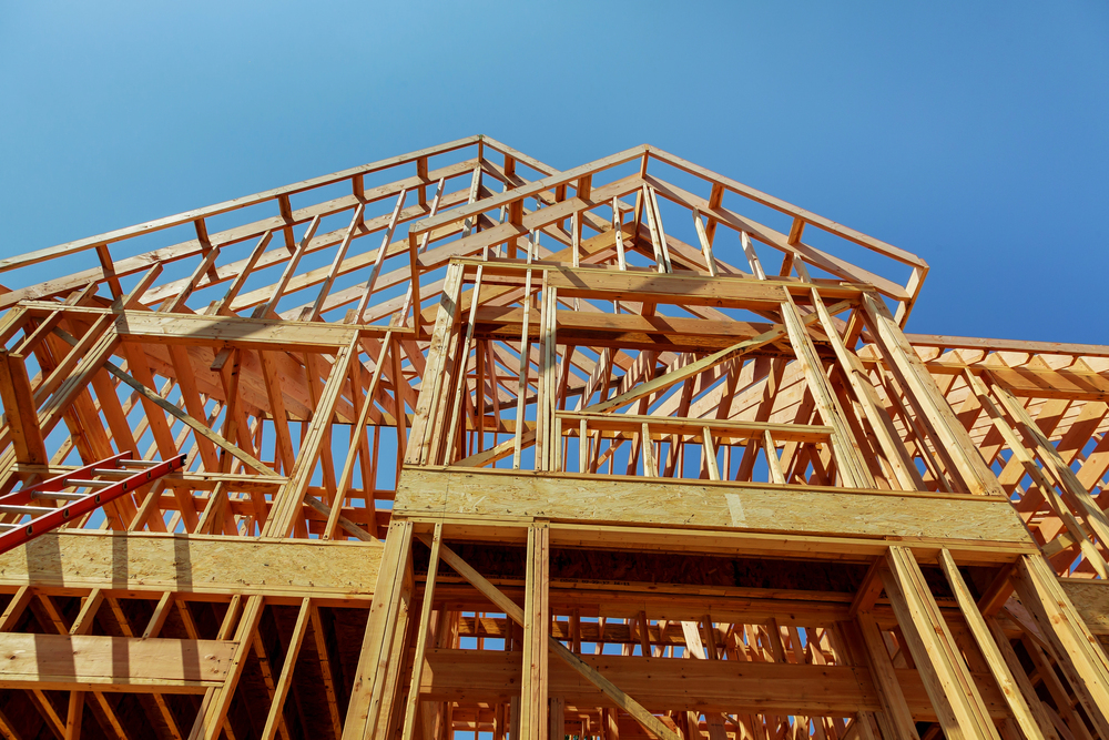 Wood framework of new residential home under construction. Home Under Construction - stock image