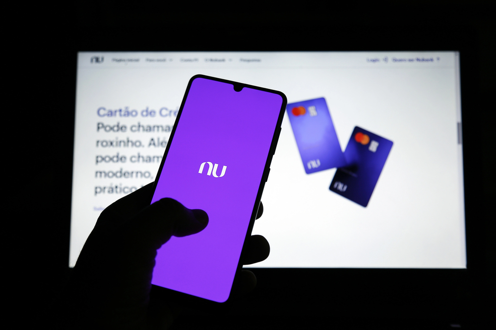 mobile phone display and site with new Nubank brand. Digital payment system