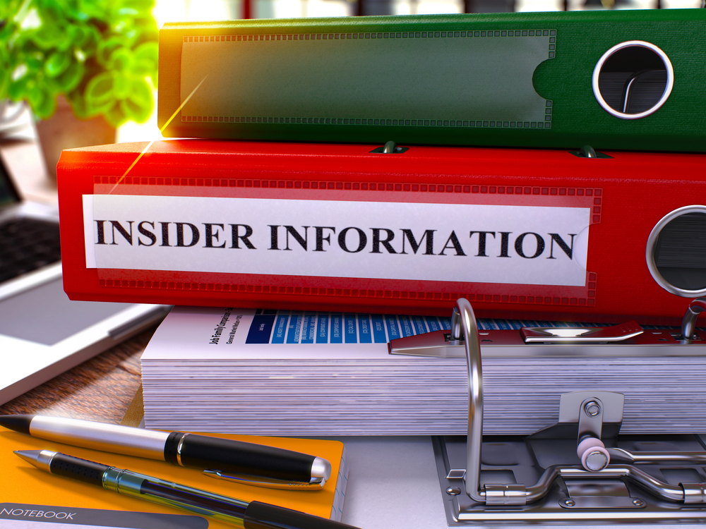 Red binder with label reading 