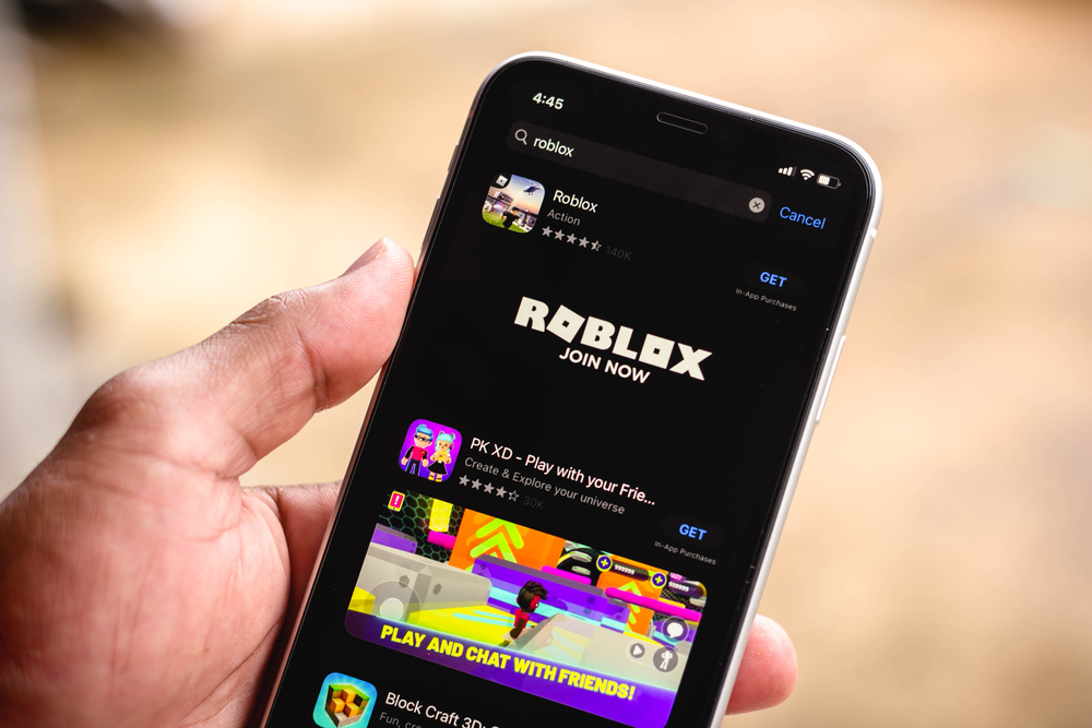 the Roblox logo in App Store displayed on a smartphone screen