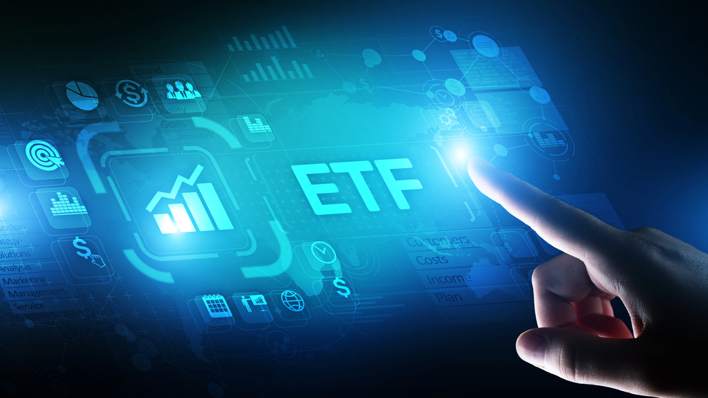 Investor pointing at rising ETF chart.