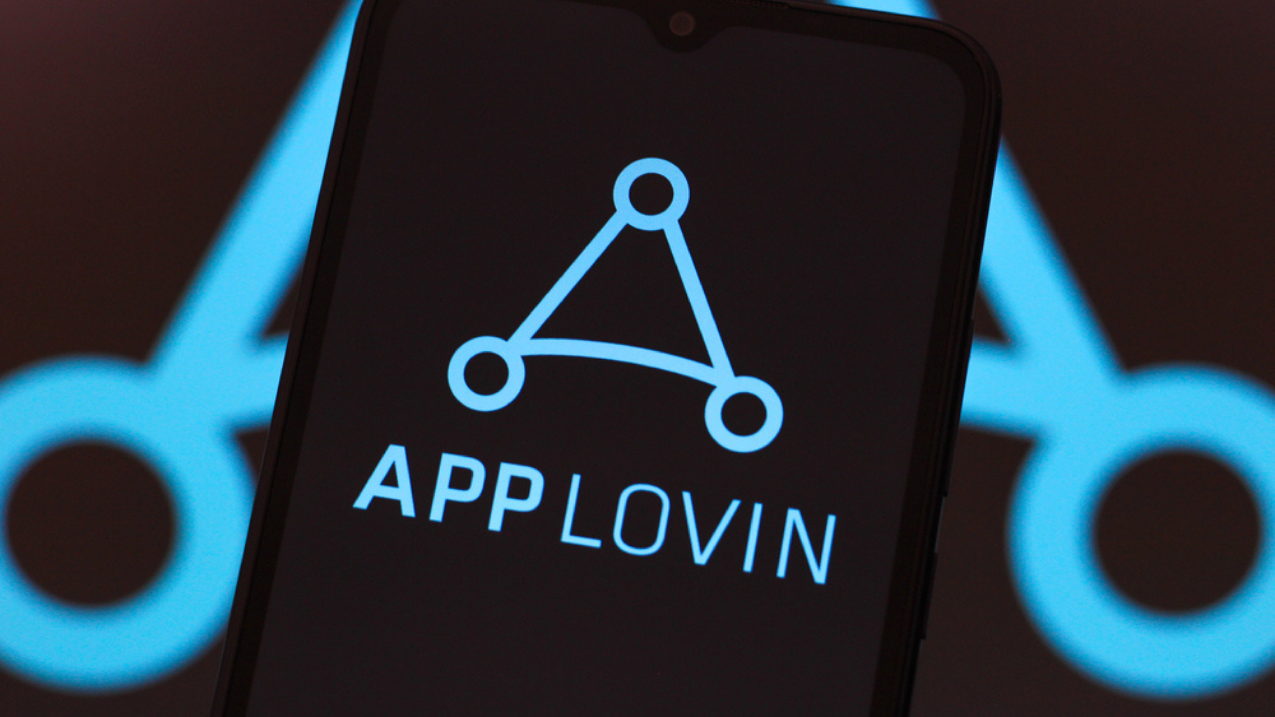 AppLovin logo on cellphone screen.