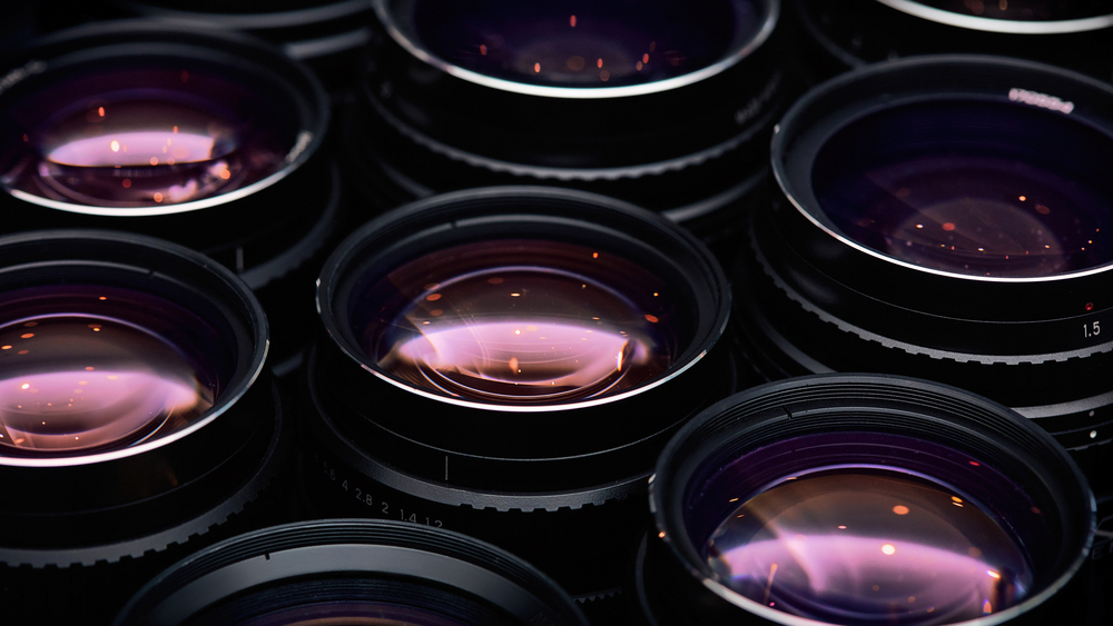 High-aperture camera lenses with reflections.