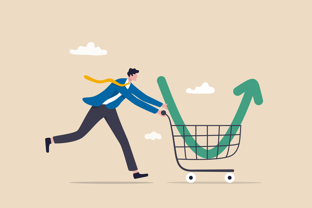 Businessman pushing a shopping cart carrying a rising green arrow symbolizing a 