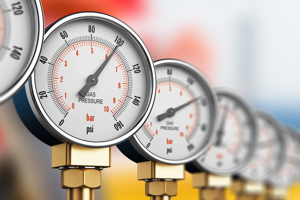 Row of industrial high pressure gas gauges. 