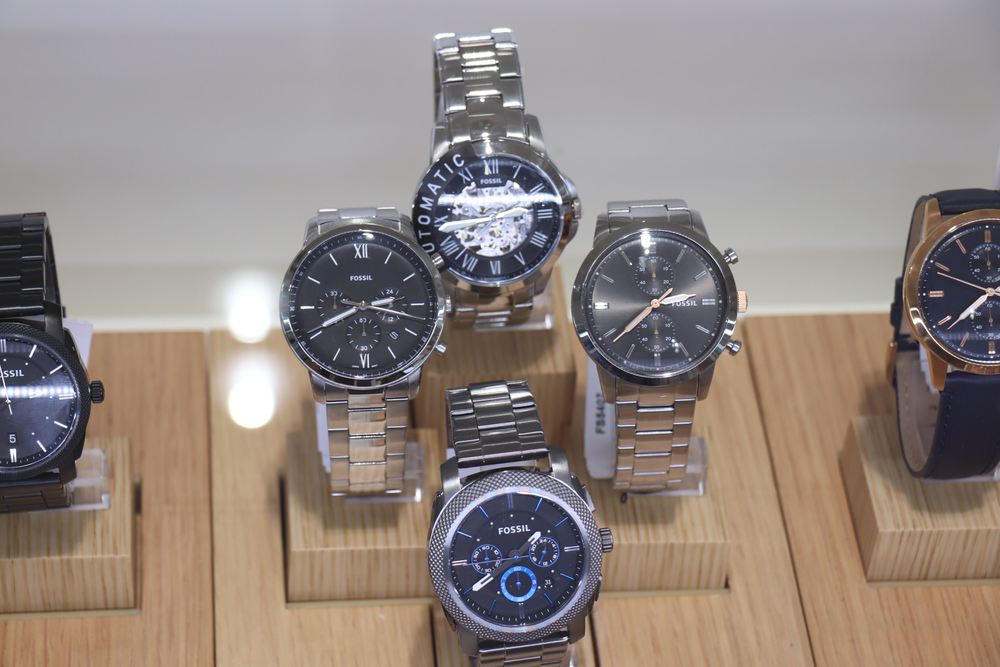 Fossil watches in a shop window.