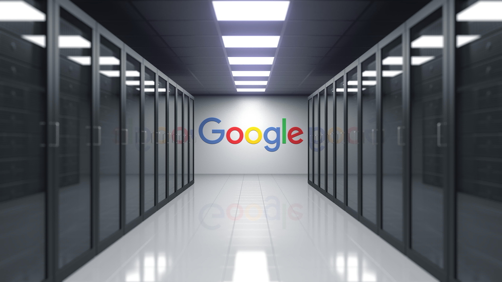 Google logo on the wall within a server room. 