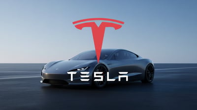 Tesla vehicle with company branding in the foreground.