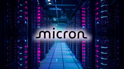Micron logo glows over a neon-lit data center corridor, highlighting the company’s role in high-bandwidth memory.