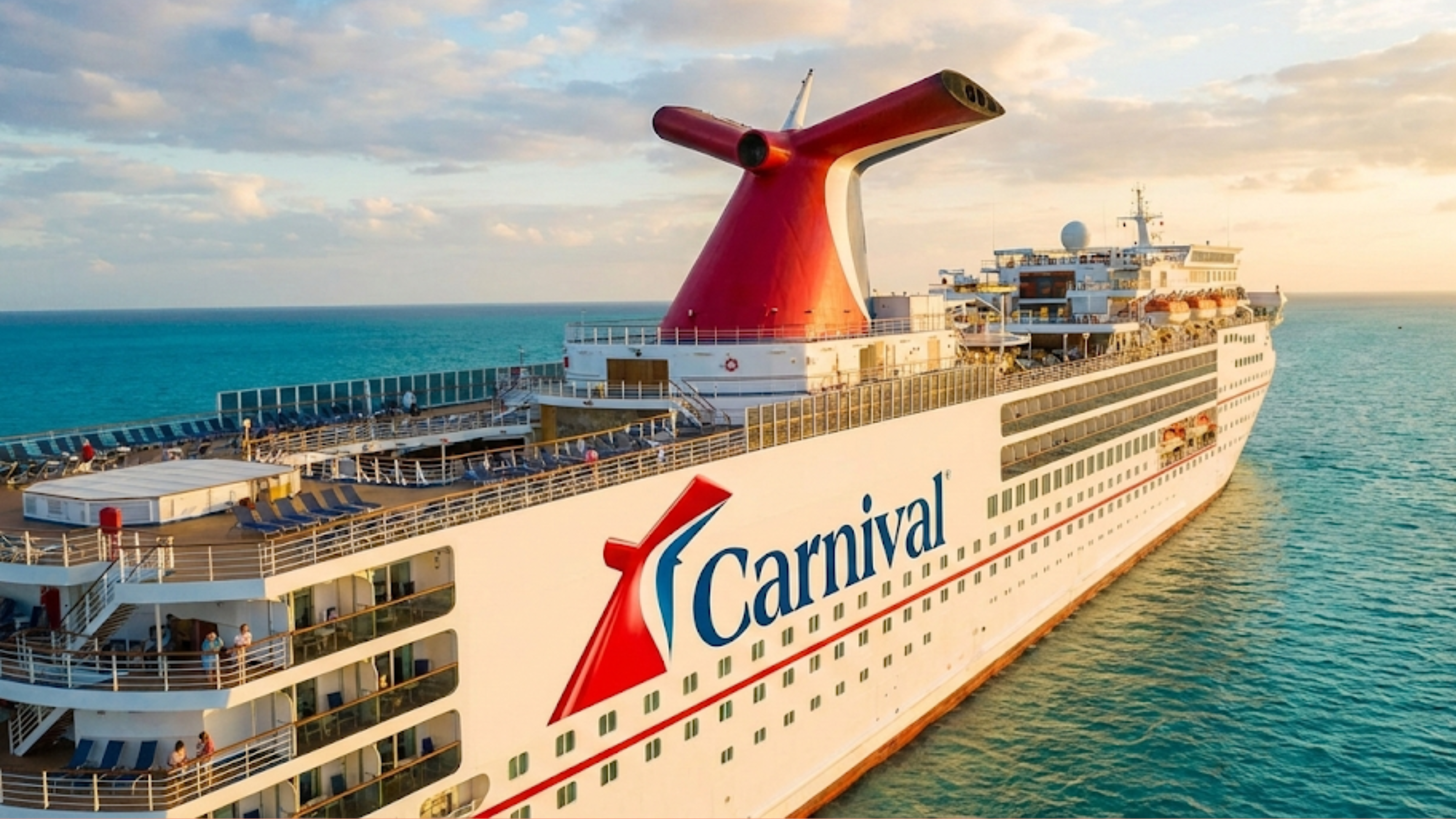 Carnival cruise ship sails at sunset over calm blue water, highlighting travel demand.