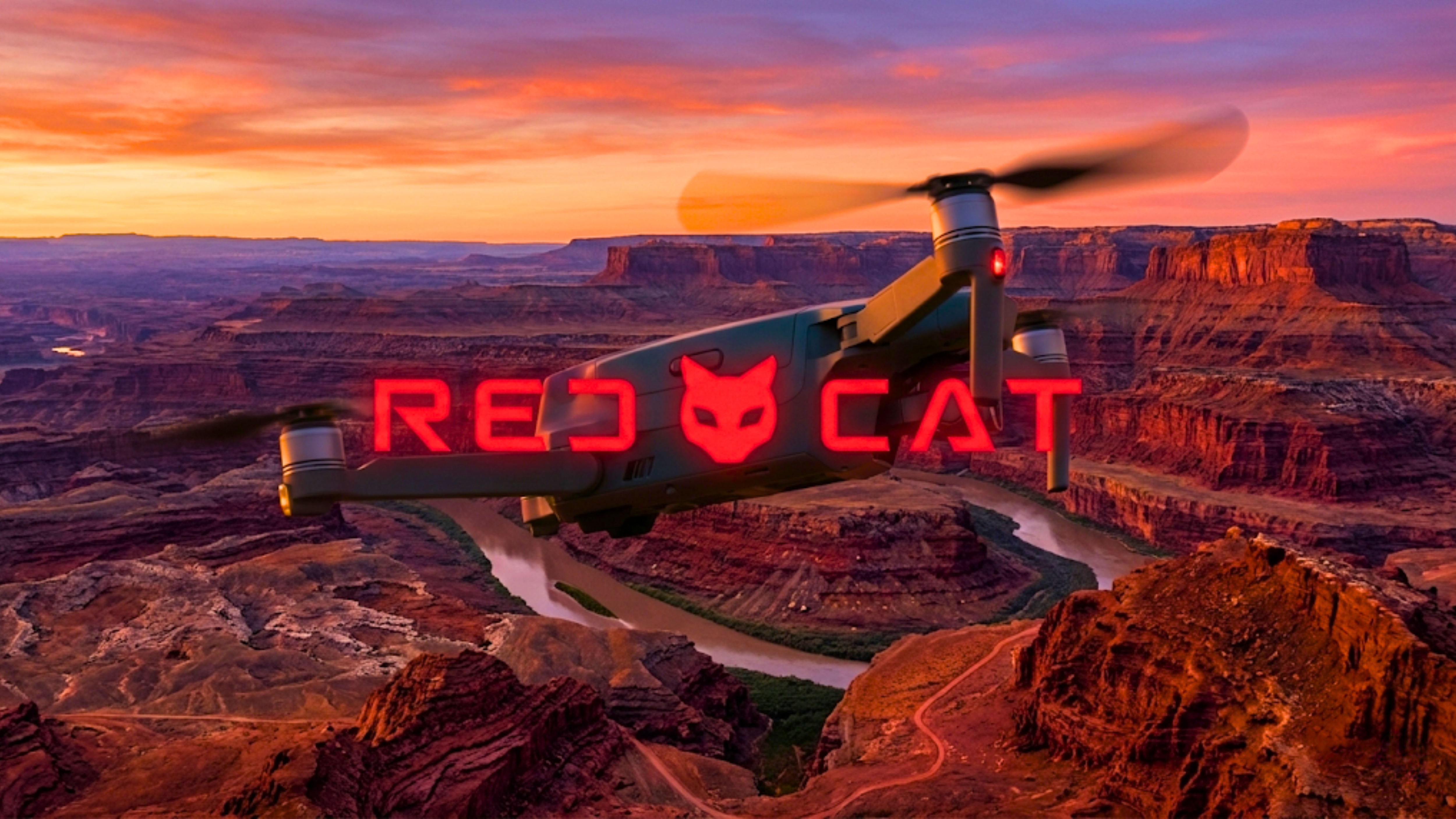 Red Cat military drone flying over rugged terrain highlights defense technology innovation.