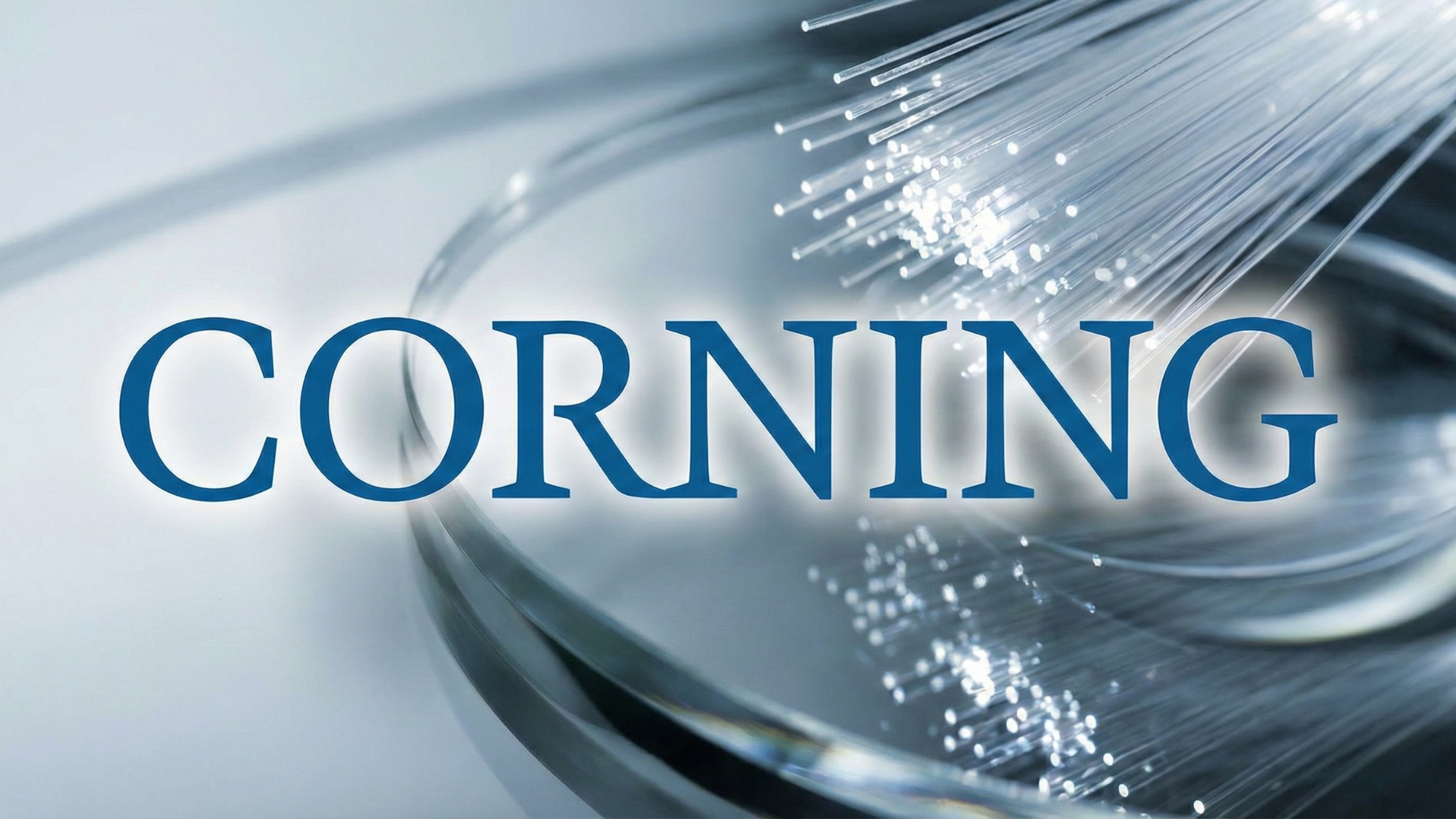 Corning logo over glowing fiber-optic strands, highlighting its AI data-center connectivity business.
