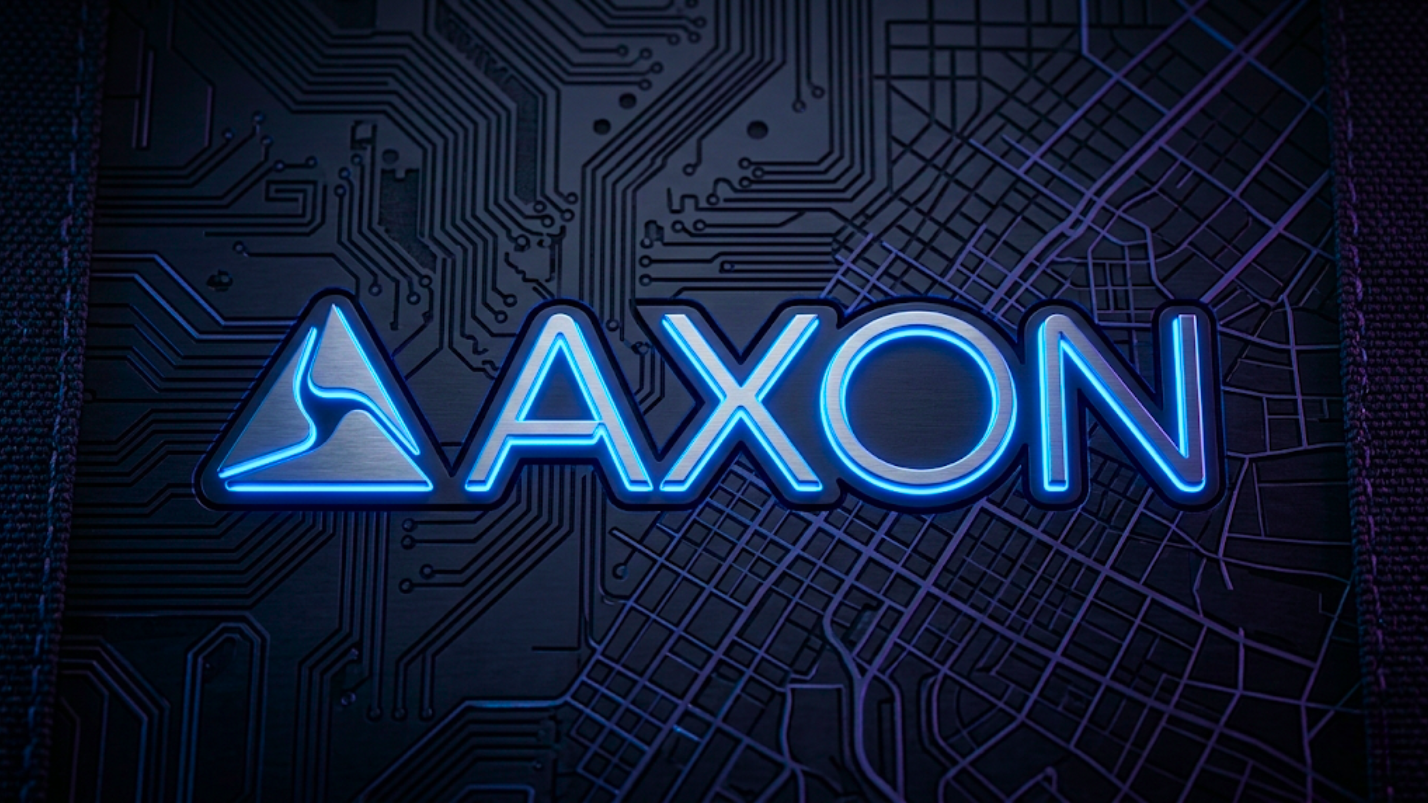 Axon Enterprise logo over circuit board and city grid, highlighting AXON public safety tech and AI growth.