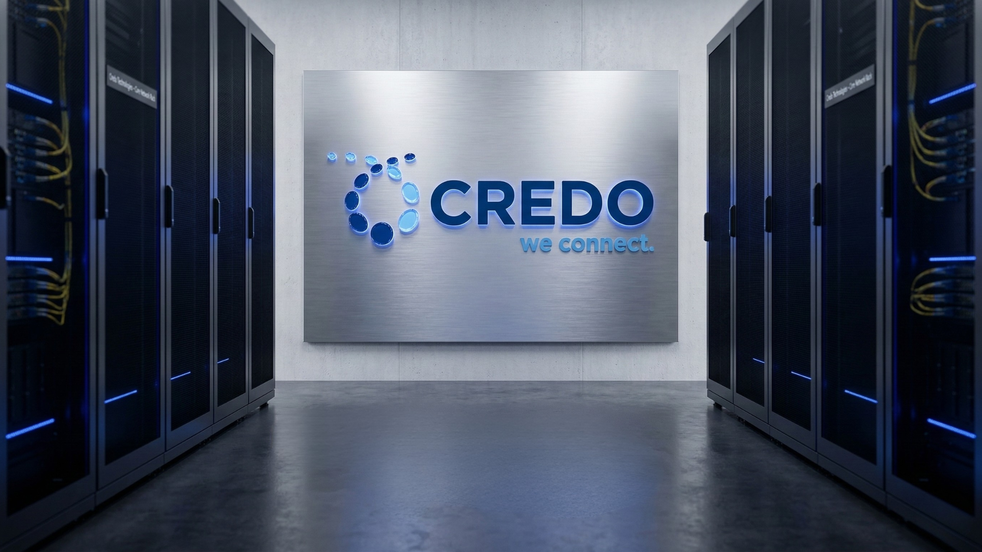Credo Technologies logo displayed inside a modern AI data center with server racks, highlighting AI infrastructure growth.