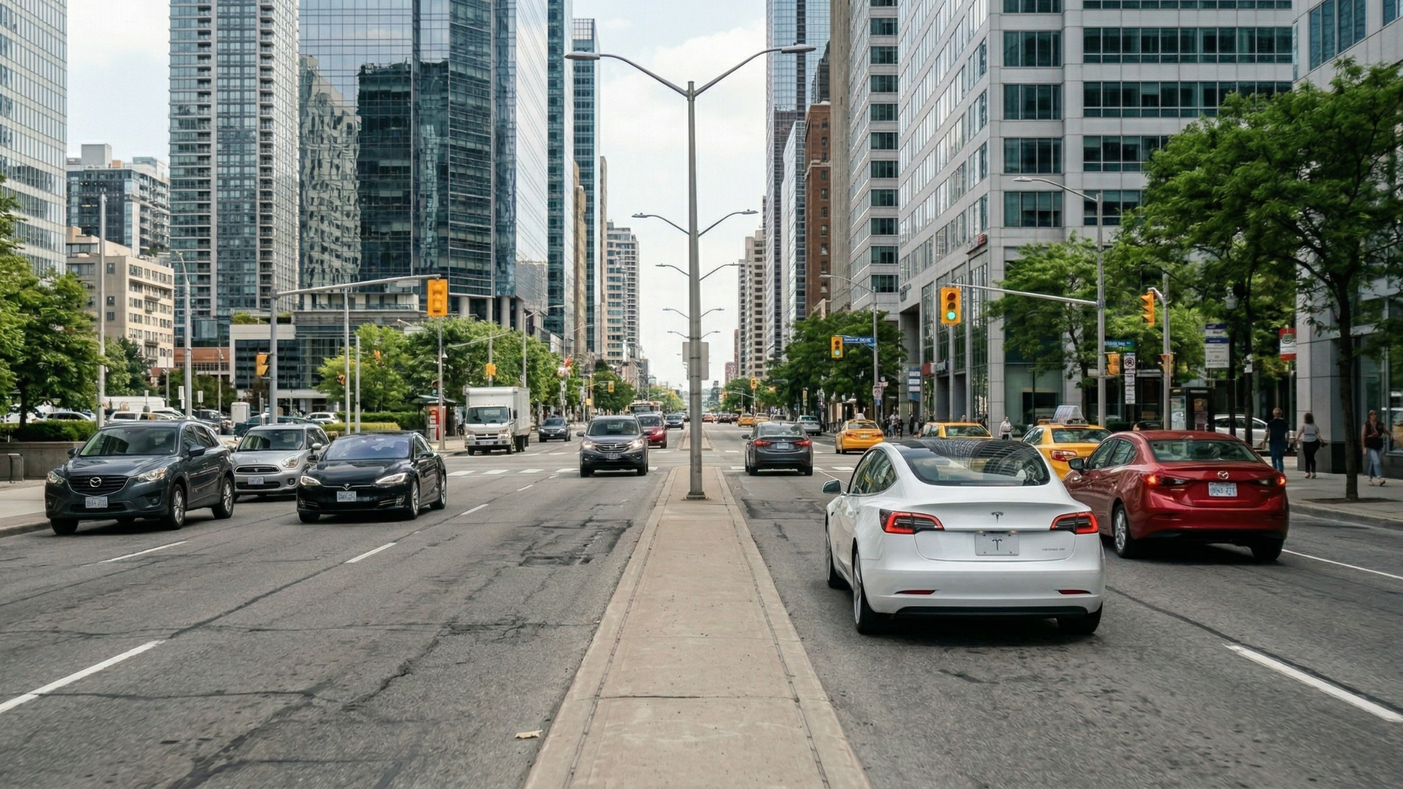 Tesla electric vehicle driving through city traffic, reflecting autonomy concerns and regulatory scrutiny around self-driving technology.