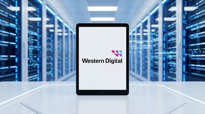 Western Digital logo displayed on a tablet screen in front of a data center server room.