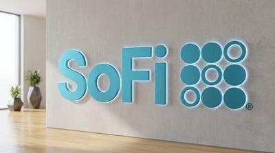 SoFi Technologies logo mounted on a concrete wall in a modern office lobby setting.