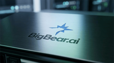 BigBear.ai company logo displayed on a brushed metal surface in a dimly lit setting.
