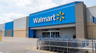 Exterior of a Walmart retail store with shopping carts in the foreground.