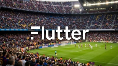 Flutter Entertainment logo overlaid on a blurred image of a packed soccer stadium.