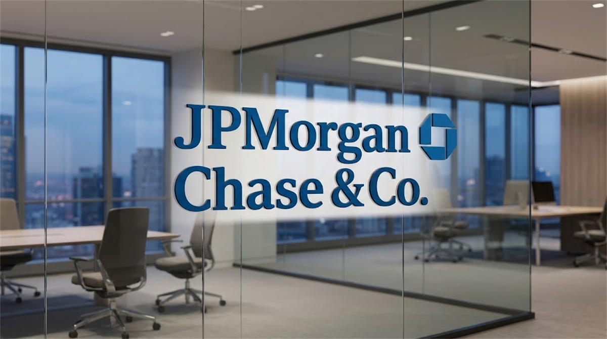 JPMorgan Chase and Co. logo displayed on a glass wall inside a modern corporate office.
