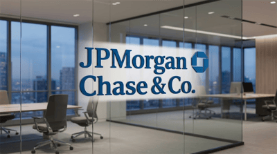 JPMorgan Chase and Co. logo displayed on a glass wall inside a modern corporate office.