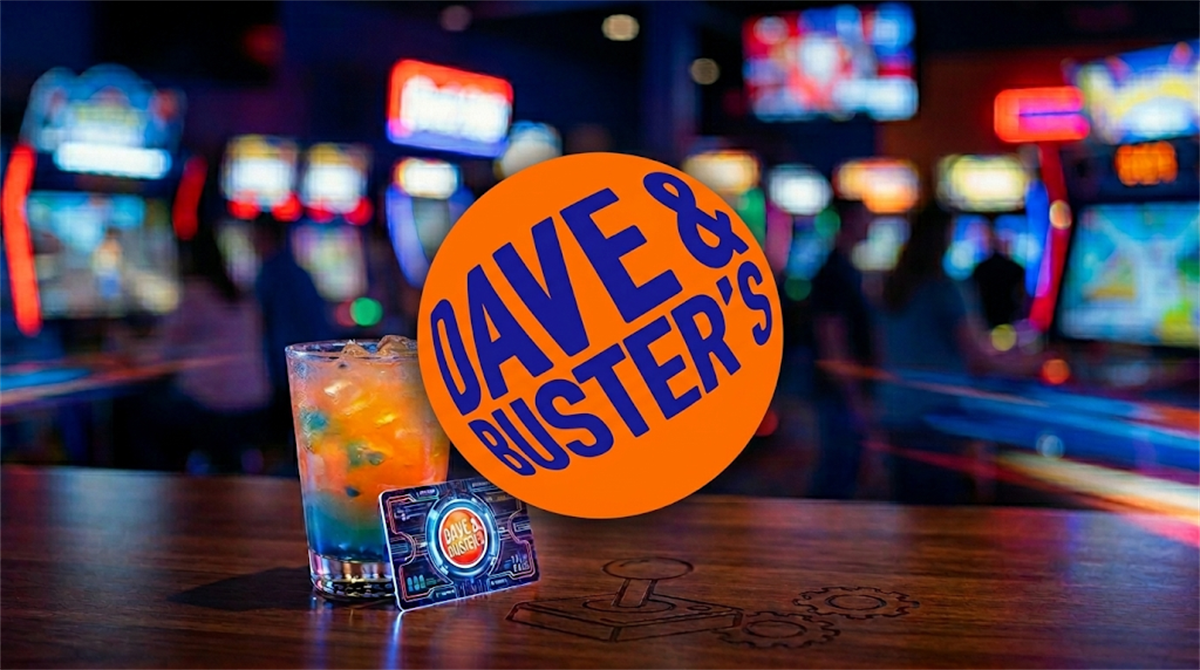 Dave and Buster's logo displayed over a branded game card and cocktail inside an arcade venue.