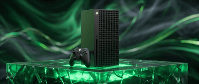 Microsoft Xbox Series X gaming console and wireless controller displayed on a green-lit platform.