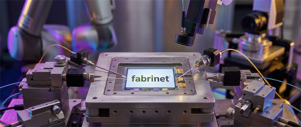 Fabrinet logo displayed on a semiconductor component mounted in precision optical testing equipment.