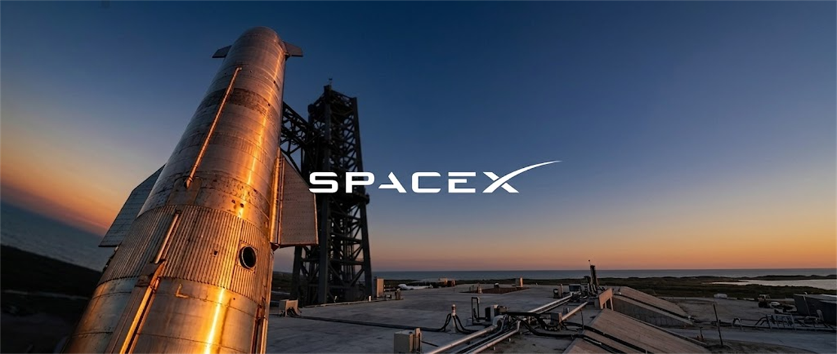 SpaceX Starship rocket stands on the launch pad at sunset with the SpaceX logo overlay.