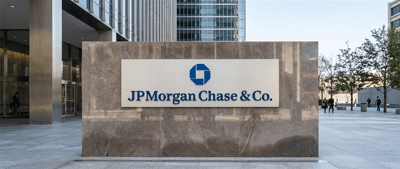 JPMorgan Chase and Co. logo on a granite exterior sign outside a corporate office building.
