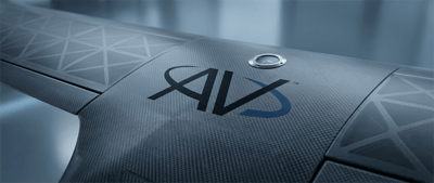 Close-up of a carbon fiber surface bearing the AV logo and a camera sensor.