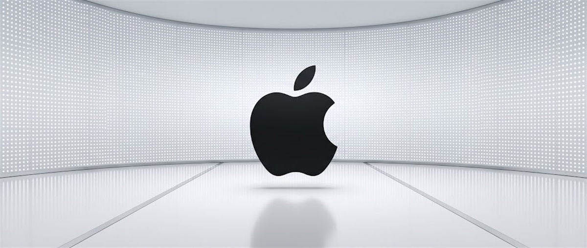 Apple Inc. logo displayed against a curved white LED wall backdrop.