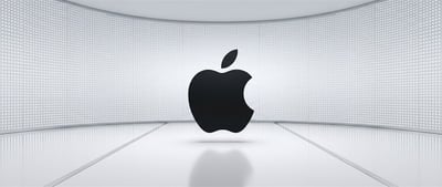 Apple Inc. logo displayed against a curved white LED wall backdrop.