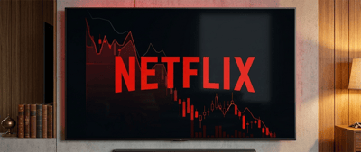 Netflix logo displayed on a wall-mounted TV alongside a declining red stock price chart.