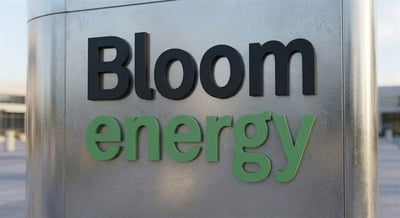 Bloom Energy corporate logo displayed on a metal exterior sign outside a company facility.