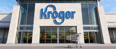 Exterior of a Kroger grocery store with a shopping cart in the foreground.