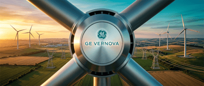 GE Vernova logo on a wind turbine hub, with wind turbines and power lines across farmland in the background.