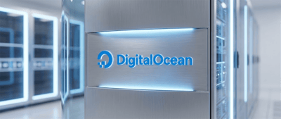 DigitalOcean logo illuminated on a metal server panel inside a data center with rows of servers.