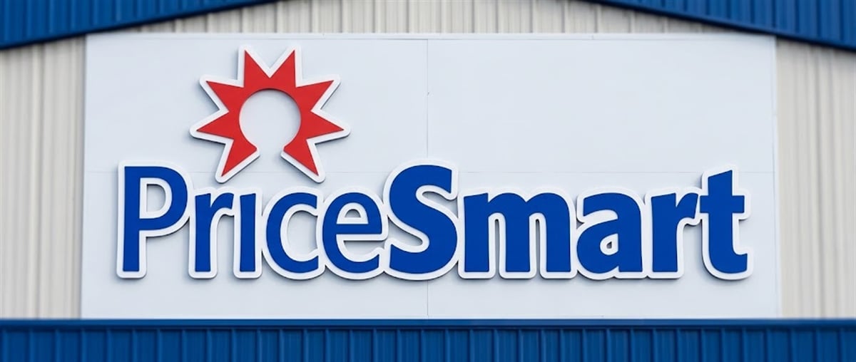 PriceSmart logo with red star icon displayed on a sign mounted on a building exterior.