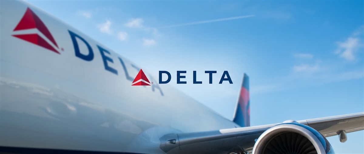 Delta Air Lines logo displayed over a close-up of the airline's aircraft fuselage, tail, and engine against a blue sky.