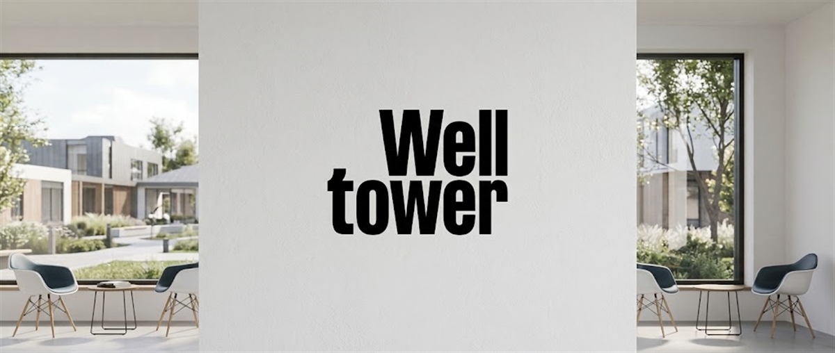 Welltower name displayed on a wall in a modern lobby with chairs and windows overlooking a courtyard.