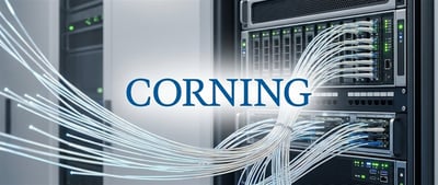 Corning logo displayed over fiber optic cables connected to server racks in a data center.